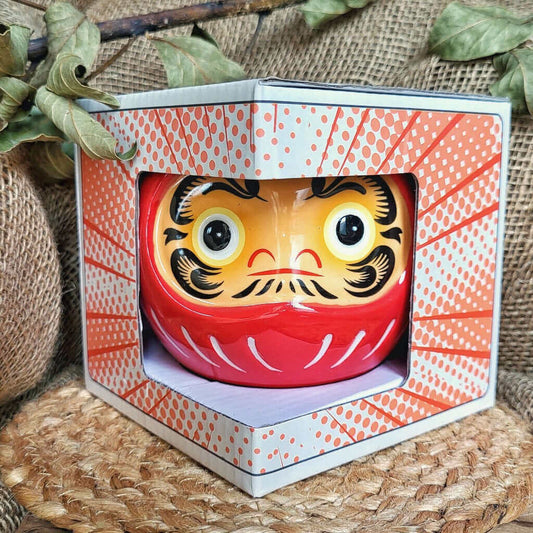 Bruciatore o bruciaessenze per tart profumate in ceramica con desing unico a forma di bambola daruma giapponese.
